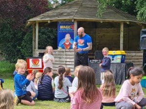 Children enjoying outdoor storytelling at Inchmarlo Community Park in Aberdeenshire.