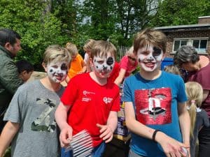 Children enjoying outdoor activities at Inchmarlo in sunny weather.