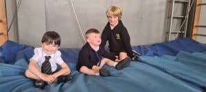 Children playing on gym mats at Inchmarlo, enjoying active and engaging indoor play.