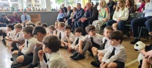 Students sitting attentively in school assembly at Inchmarlo.