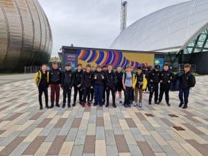 Group of people outdoors at Inchmarlo, Scottish estate and golf course.