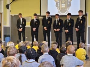 Students giving a presentation at Inchmarlo School, showcasing a welcoming educational environment in Aberdeenshire.