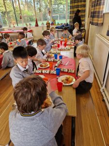Children enjoying a meal at Inchmarlo school event, colorful setting, engaging environment.
