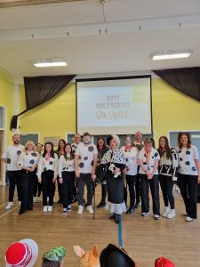 Group of children performing on stage at Inchmarlo school event.