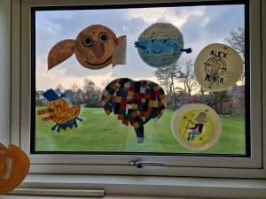 Colorful artwork display at Inchmarlo community, showcasing creativity and community engagement.