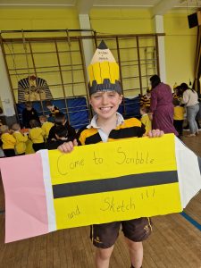 Happy child with a pencil costume at Inchmarlo school event.