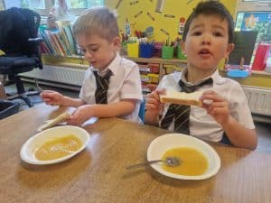 Children enjoying a healthy meal at Inchmarlo nursery.