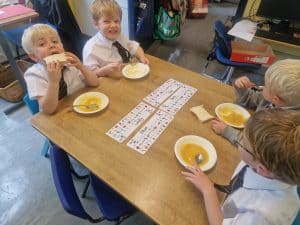 Children enjoying a snack at Inchmarlo educational center.