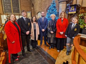 Group of staff members celebrating Christmas at Inchmarlo, showcasing festive holiday spirit.