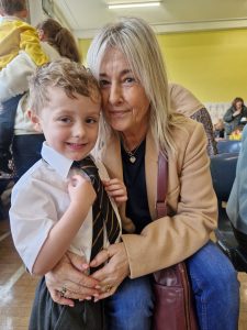 Happy boy with elder woman at Inchmarlo center.