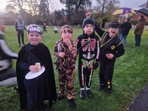 Children in Halloween costumes at Inchmarlo outdoor event, family-friendly activities in a scenic setting.