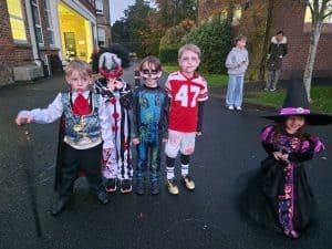 Children in costumes at Inchmarlo estate for Halloween celebrations.