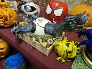 Colorful Halloween and cartoon character themed party decorations with spooky and playful elements.