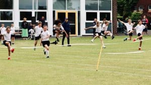 Children running during outdoor sports day at Inchmarlo School.