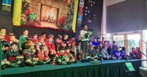 Festive children’s performance at Inchmarlo with holiday decorations and cheerful holiday spirit.