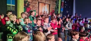 Children singing on stage at Inchmarlo Christmas concert.