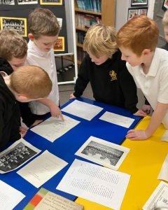 Students collaborating on educational activities at Inchmarlo School in a classroom setting.
