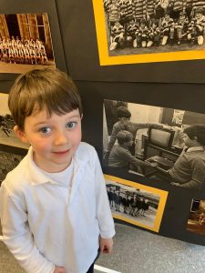 Young boy visiting Inchmarlo historic estate exhibit.