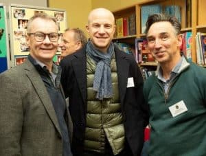 Three men smiling at book event in Inchmarlo.