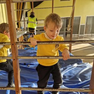 Children playing on indoor play equipment at Inchmarlo education center.