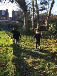 Two children playing outdoors at Inchmarlo estate in Scotland.
