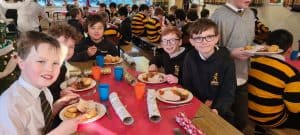 Students enjoying a school lunch at Inchmarlo, a vibrant and welcoming educational environment.