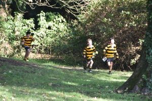 Children playing in lush green outdoor area at Inchmarlo.