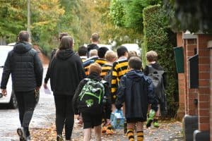 Students walking to school at Inchmarlo, engaging in outdoor activity and early education in a safe environment.