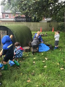 Children enjoying outdoor activities in Inchmarlo garden.