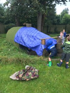 Children playing on outdoor playground with slide and climbing equipment at Inchmarlo.