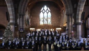 Elegant event in historic Inchmarlo Hall with grand architecture and festive decor.