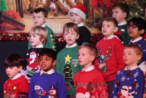 Children Christmas choir performing festive songs at Inchmarlo.