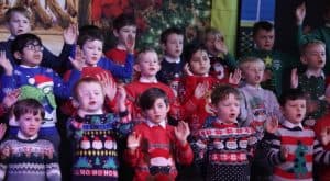 Children singing Christmas carols at Inchmarlo school event.