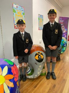 Two children in school uniforms at Inchmarlo school event.
