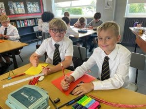 Students in classroom enjoying learning activities at Inchmarlo School.