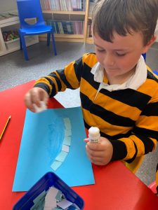Child engaging in arts and crafts activity at Inchmarlo early learning center.