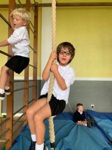 Children playing on gym equipment at Inchmarlo school.