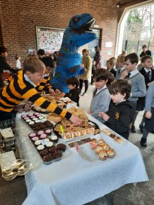 Children enjoying a birthday party with dinosaur costume at Inchmarlo.