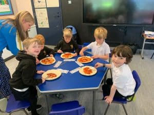 Children enjoying a meal together at Inchmarlo school cafeteria.