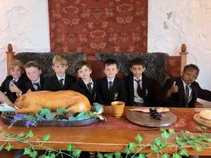 Students enjoying a meal together at Inchmarlo, showcasing a warm, welcoming school environment.