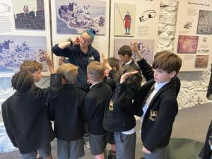 Students engaging with historical exhibits at Inchmarlo.