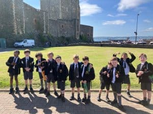 Students in school uniforms enjoying outdoor activities at Inchmarlo estate.