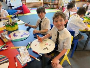 Children engaging in creative art activities at Inchmarlo Preschool.