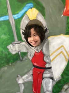 Child dressed as knight at Inchmarlo Castle.