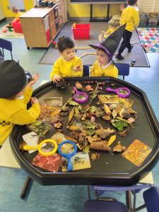 Children engaging in sensory play at Inchmarlo childcare center.