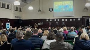 Indoor meeting with audience watching presentation, community event at Inchmarlo.