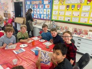 Students engaging in classroom arts and crafts at Inchmarlo school.