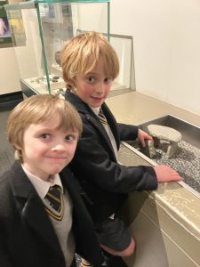 Two young boys exploring at Inchmarlo, a family-friendly Scottish estate with educational activities.
