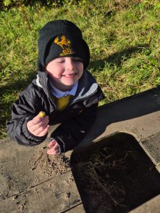 Child enjoying outdoor activity at Inchmarlo estate, scenic nature and fresh air.