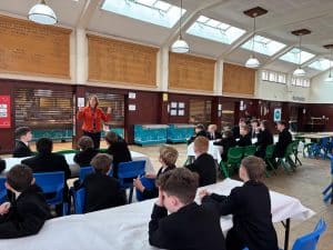 Students engaging with a teacher in a classroom setting at Inchmarlo School.